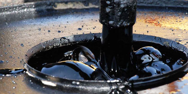 Bitumen being applied for tar and asphalt use